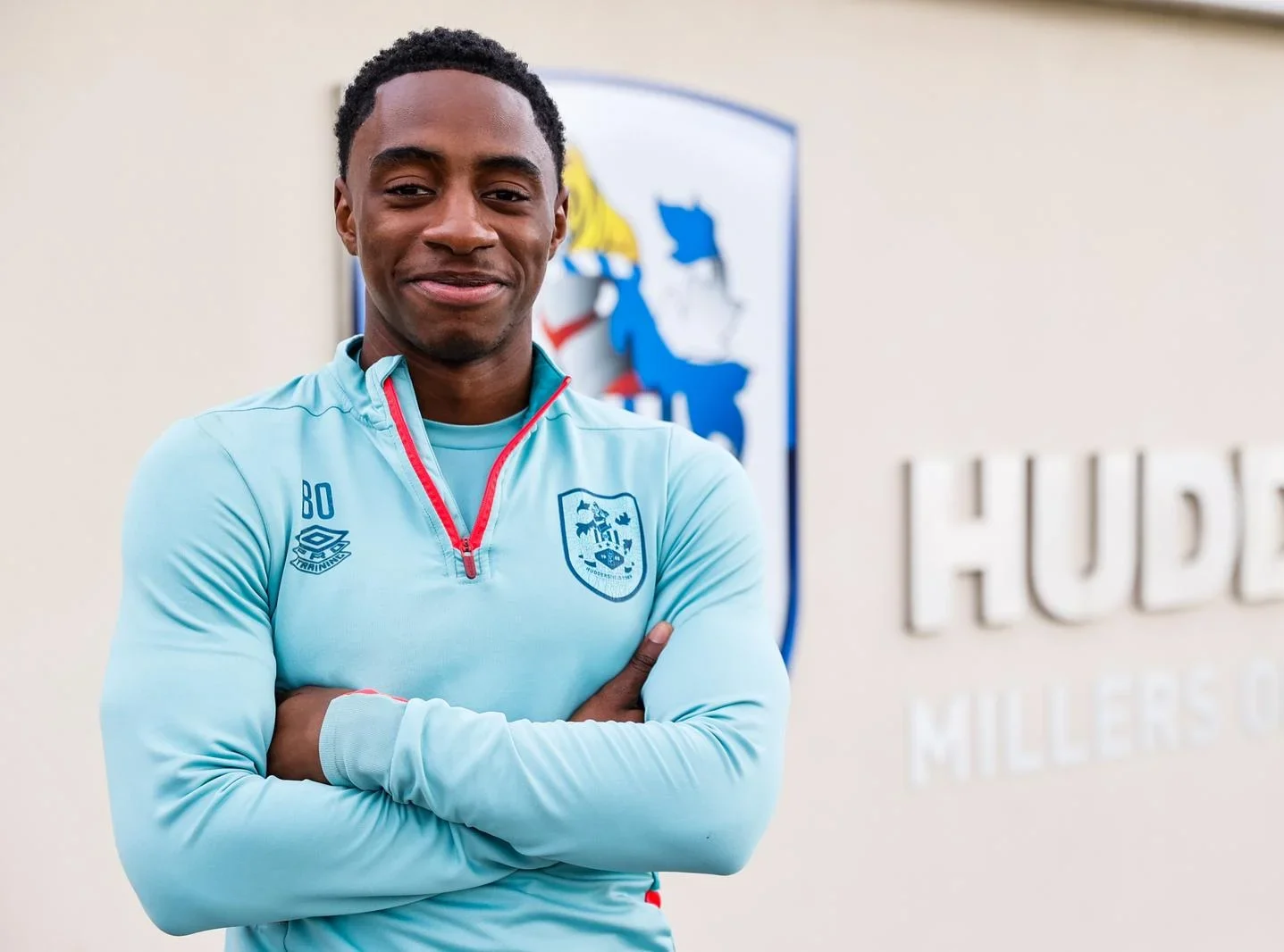 Omari Mrisho signs first pro contract Huddersfield Town A.F.C